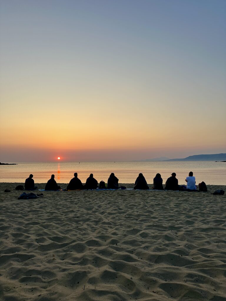 group of gay men on retreat in Crete sunrise